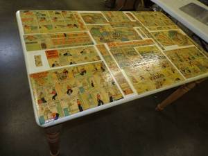 lot 26 image: 25 Colored Comics Wood Table