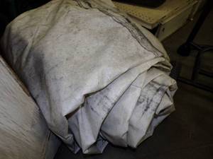 lot 64 image: Large Tarp may have holes great for woodpile White