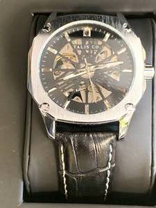 lot 3 image: New Talis Co. Black Skeleton Watch $659 retail
