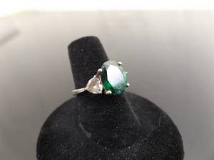 lot 56 image: .925 Sterling Silver Oval Cut Emerald Crystal Ring Size 6.75