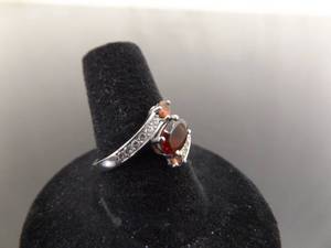 lot 58 image: .925 Sterling Silver Garnet Ring Size 8