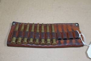 lot 86 image: 8 Rounds .30-30 Win SP Ammo in Leather Holder