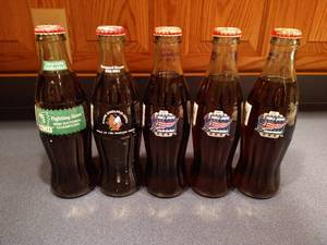 lot 132 image: (5) Full Hockey Coke Bottles