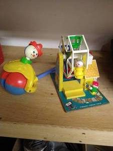 lot 425 image: Vintage Fisher Price Ferris Wheel & Push Silly Clown