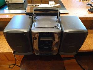 lot 503 image: Optimus Portable Stereo, Wireless Phone Charger & Clock Radio