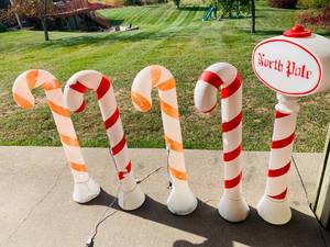 lot 128 image: Candy Cane Light Up Blow Mold Holiday Decoration