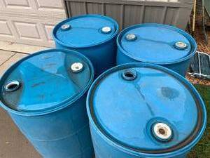 lot 122 image: Big Blue Plastic 50 Gallon Barrels