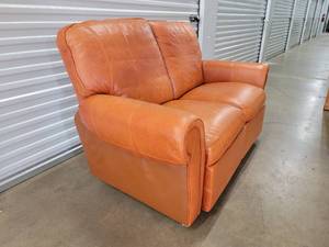 lot 6 image: Burnt Orange Reclining Leather Loveseat
