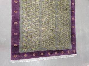 lot 46 image: Tibet Rug Company Plum and Olive Wool Rug