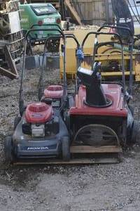 pallet of untested snowblowerslawn mowers