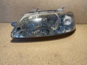 lot 22 image: 2002-2005 Chevy Aveo Used Drivers Side Headlight Assembly. Pre-Facelift.