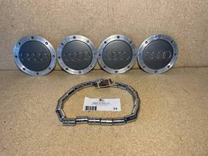 lot 24 image: Audi A3S3 Center Caps and Locking Tuner Lug-nuts with key