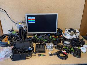 lot 34 image: Large Lot of Electronics, Dell 20 Monitor, WIIs, HDMIRCACoaxial Cables, and Power Supplies