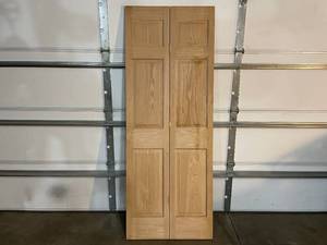 lot 53 image: 30x79 Solid Oak 6 Panel Bi-Fold Interior Door Slab. Never Installed