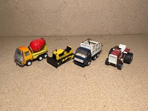 lot 69 image: Lot of 4 Smaller Tonka Trucks and Toys. Cement Truck, Bulldozer, Garbage Truck, and Farm Tractor