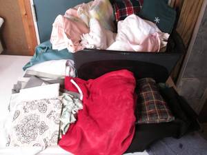 Covered tote full of blankets, shee...