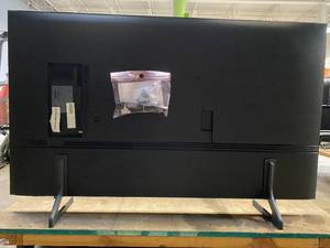 lot 983 image: QN50Q60BAF Samsung - 50 Class Q60B QLED 4K Smart Tizen TV (TECHNICIAN TESTED LIKE-NEW, SLIGHTLY WARPED AND CORNER SCUFF Upper LH Front Bezel.)