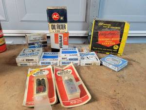 lot 285 image: Lot of Exhaust Clamps, 12 & 14mm Wheel Stud Kits, Wisconsin Engine Parts, Rewind and Filters