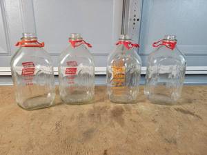 lot 308 image: (4) Antique 12 Gallon Milk Bottles