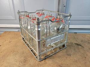 lot 309 image: (6) Antique 12 Gallon Milk Bottle in Marigold Dairy Steel Crate