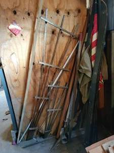 lot 382 image: Trellises, Hand Rail, US Flag w Pole, Fence Post and More in Corner - NO SHIPPING