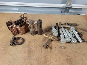lot 385 image: Lot of 3-Point Lower Arm Pins, hitch Pins, PTO Adapters and Stake Pockets