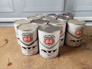 lot 394 image: (12) Vintage PHILLIPS 66 1 Quart ATF Cans - All Full - One Leaked - NO SHIPPING