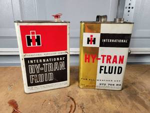 lot 395 image: (2) Vintage International Harvester 1 Gallon Transmission Fluid Cans - NO SHIPPING