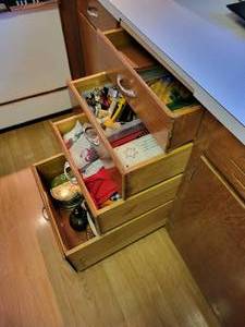 lot 55 image: Contents of (4) Kitchen Drawers - Tupperware, Pampered Chef, Linens, Home Dcor, and MORE NO SHIPPING
