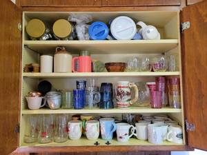 lot 56 image: Contents of Kitchen Cupboard - Vintage 7Up Glasses, Budweiser Stein, Vintage Measuring Cups, Cookie Cutters, Pitchers, and MORE NO SHIPPING