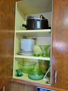 lot 58 image: Contents of Kitchen Cupboard - Green Depression Glass, Kitchen Utensils, Decorative Plates, and MORE NO SHIPPING
