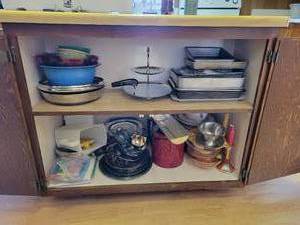 lot 59 image: Contents of Kitchen Cupboard - Sliver Plated Serve ware, Depression Glass, Vintage Bakeware, Sieve, Bread Box, Fry Pans, Bread Pans, and MORE NO SHIPPING