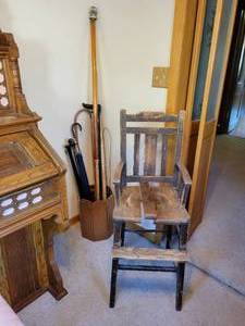 lot 64 image: Antique High Chair and Umbrella Stand with Vintage Canes, Yard Sticks, Umbrella, and MORE NO SHIPPING