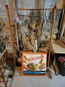 lot 195 image: Wood Clothing Rack with Sporting Goods - Baseball Bats, Rackets, Weights, Baseballs, Skittle-Bowl Game, AND MORE NO SHIPPING