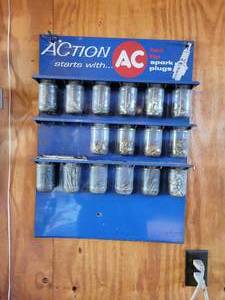 lot 414 image: Vintage AC Delco Spark Plug Display w Jars of Hardware  inventory of Hose Clamps - NO SHIPPING