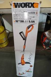 lot 21 image: WORX 15 5.5 Amp Corded Electric String Trimmer