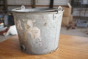 lot 177 image: Vintage Galvanized calf milking bucket w fencing staples