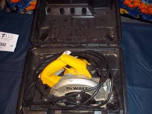 lot 140 image: DeWalt electric Circular saw in its...