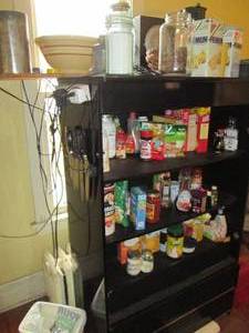 lot 131 image: Large black portable pantry filled ...