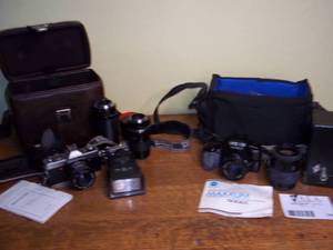 lot 354 image: 3 film cameras in two cases...