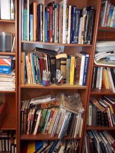 lot 380 image: Bookshelf filled with books and oth...