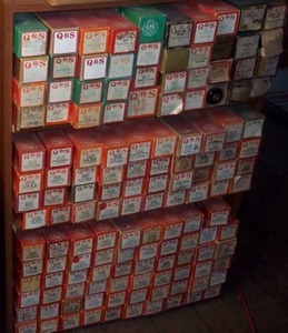 lot 403 image: Collectors dream Bookshelf filled with antique player piano rolls