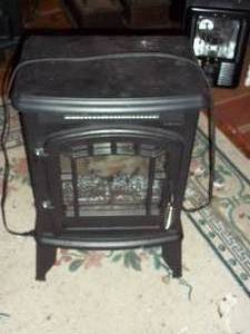 lot 504 image: Fireplace space heater...