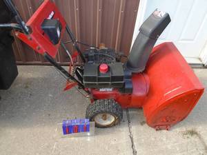 lot 101 image: Yard Machine 10 hp  24 snow blower. Used condition. Tested & works. As shown.