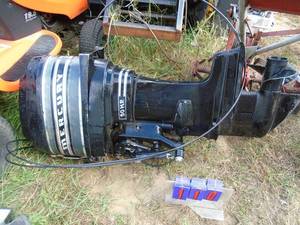 lot 110 image: 50 hp Mercury  thunderbolt out board motor. Think its a 70s model. Consignor states it was replaced with a bigger motor. Last ran about 6 years ago. Includes shift cables. As shown.