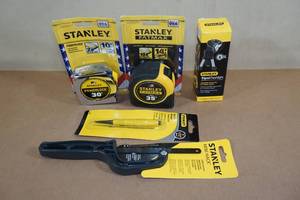 lot 31 image: Stanley Tools -2 Tape Measure, Mini Hack, Tripod Flashlight