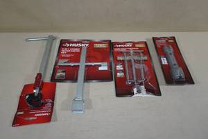 lot 59 image: Assorted Husky Tools -Basin Wrench, Water Meter Key, Faucet Sleeve Puller, Drain Wrench