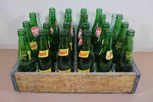 lot 209 image: Vintage Wood Shipping Crate with Vintage Squirt Bottles