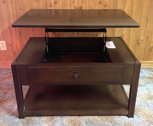 lot 74 image: Lift-Top Coffee Table by Ashley Furniture