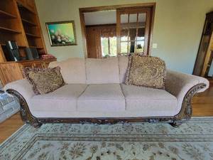 lot 11 image: Lovely Tan Couch With Wooden Features